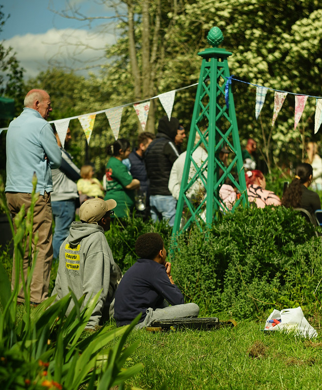 Man and boy sitting in the sunshine